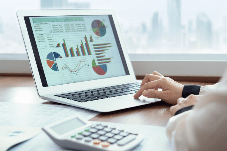 A man checking financial spreadsheet report