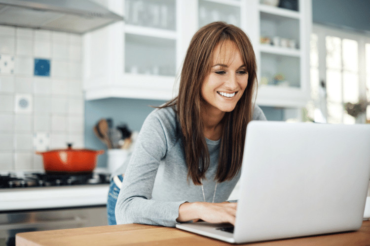 A woman working on her laptop at home