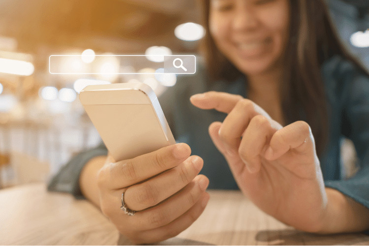 Happy Woman Searching on Smartphone