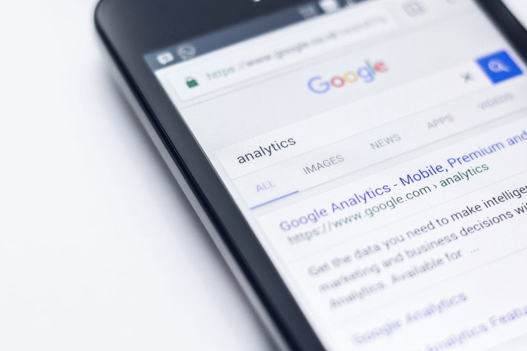 Irrelevant Keywords: 9 Risks You’re Taking and How to Avoid Them 3 Phone showing search results for Google Analytics